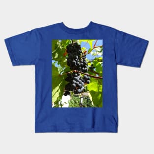 A bunch of black grapes under the blue sky Kids T-Shirt